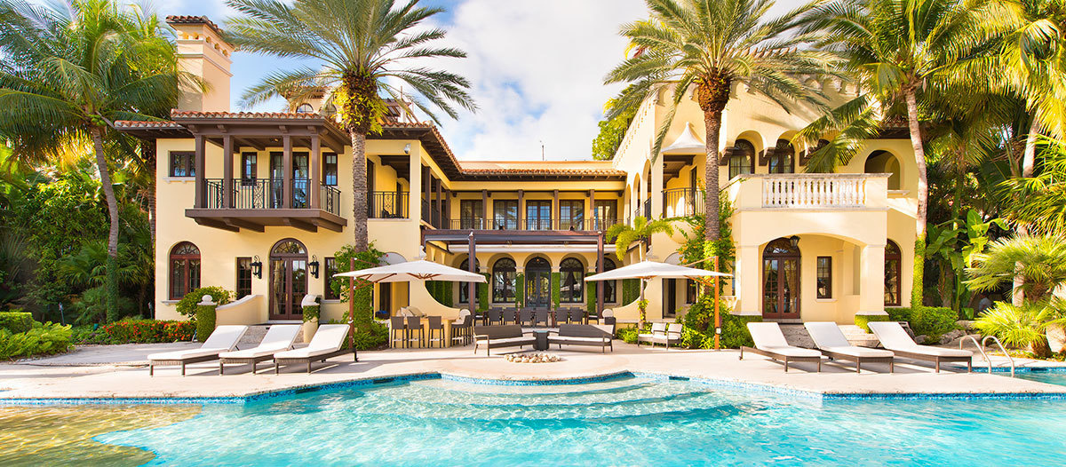 Waterfront view of Miami's Contenta villa and pool