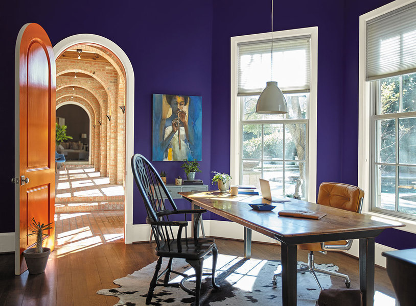 Behr paint in King’s Court, an ultra violet shade, brings the walls of this office to live.