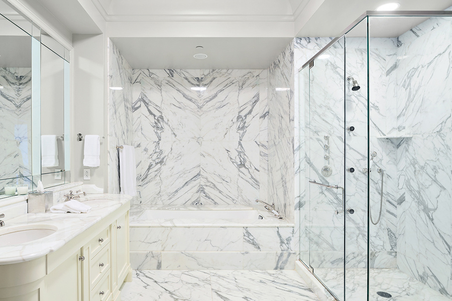The master bathroom has marble finishes and heated floors.