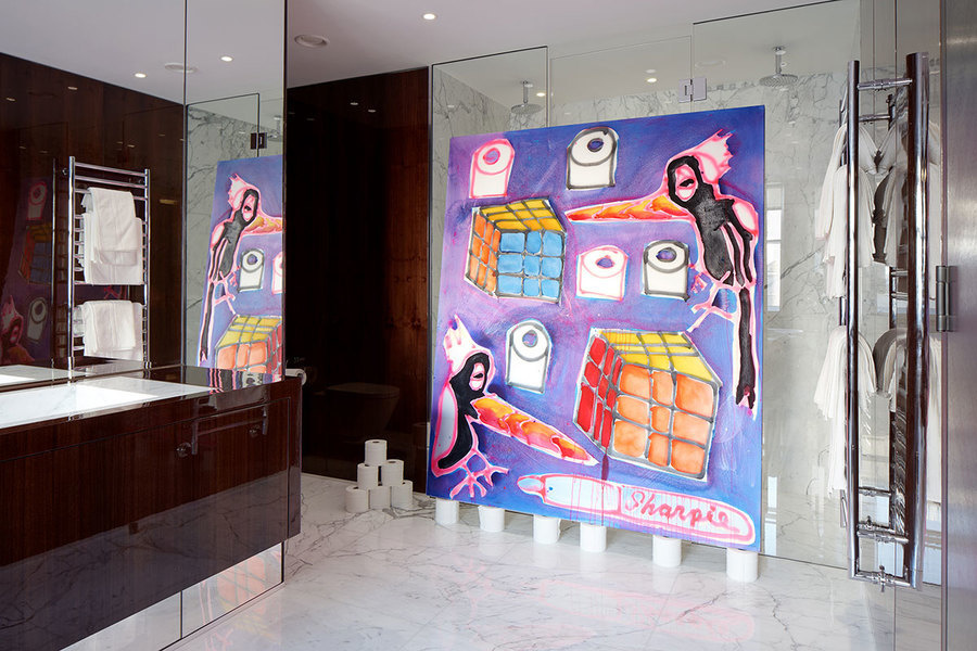 A bathroom with a painting of toilet paper rolls in The Park Crescent.