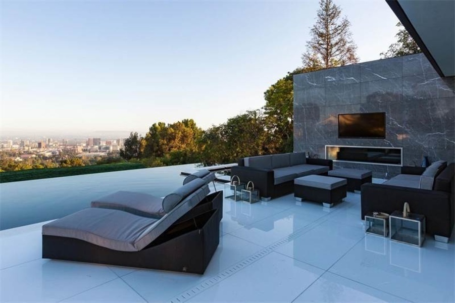The property's poolside lounge, complete with an HD television.