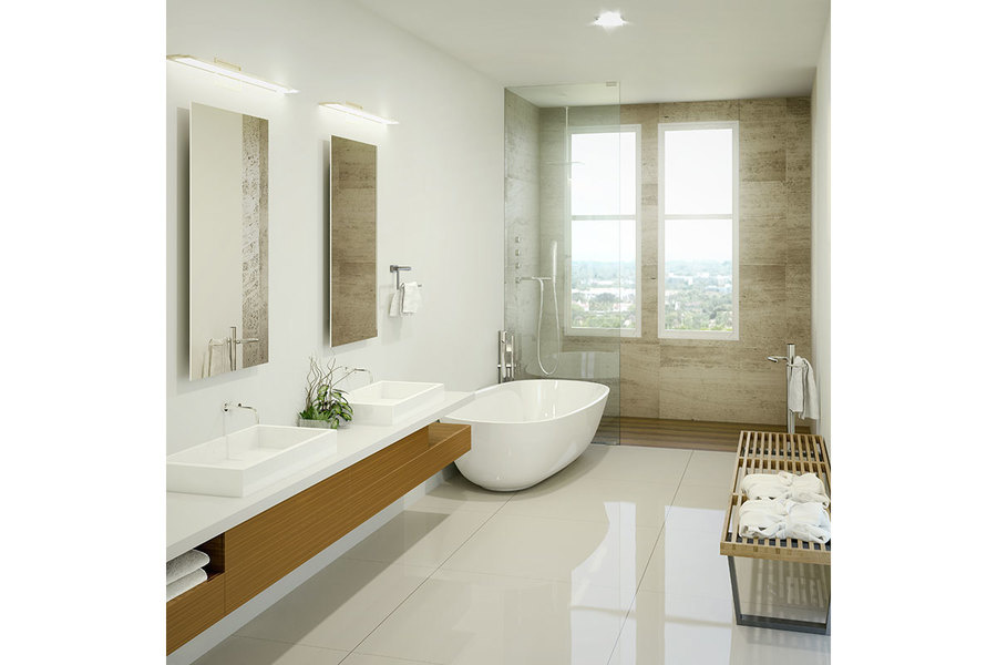 Un baño principal inspirado en un spa incluye piedra importada de Europa y una tina independiente.