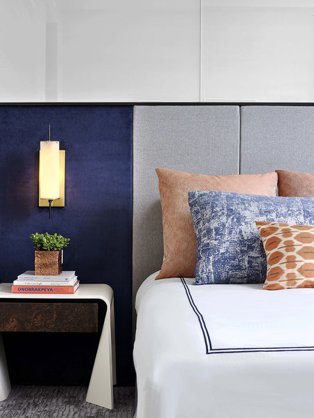 At One 57 in New York, Jeffrey Beers layered accent pillows in varying motifs bringing the look toget